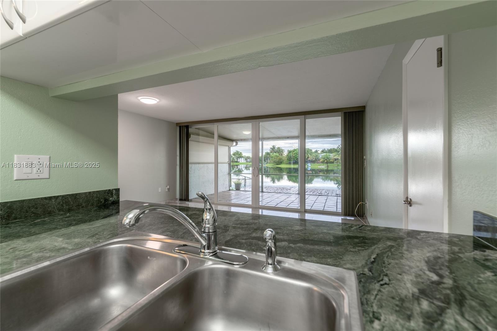 13949 Southwest 84th Street, Unit 801 Miami, FL 33143 - Photo 25 of 38 a view of a kitchen counter top space