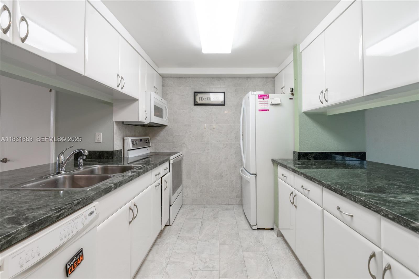 13949 Southwest 84th Street, Unit 801 Miami, FL 33143 - Photo 27 of 38 Spacious kitchen with nice countertops