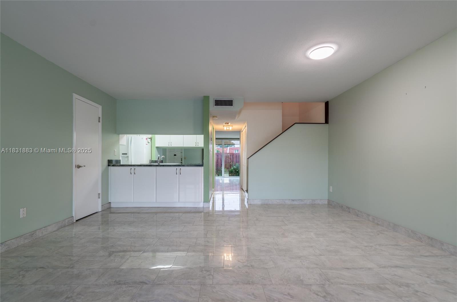 13949 Southwest 84th Street, Unit 801 Miami, FL 33143 - Photo 34 of 38 an empty room with cabinet and mirrors