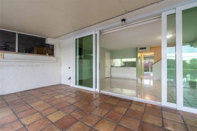 a view of an empty room with glass door