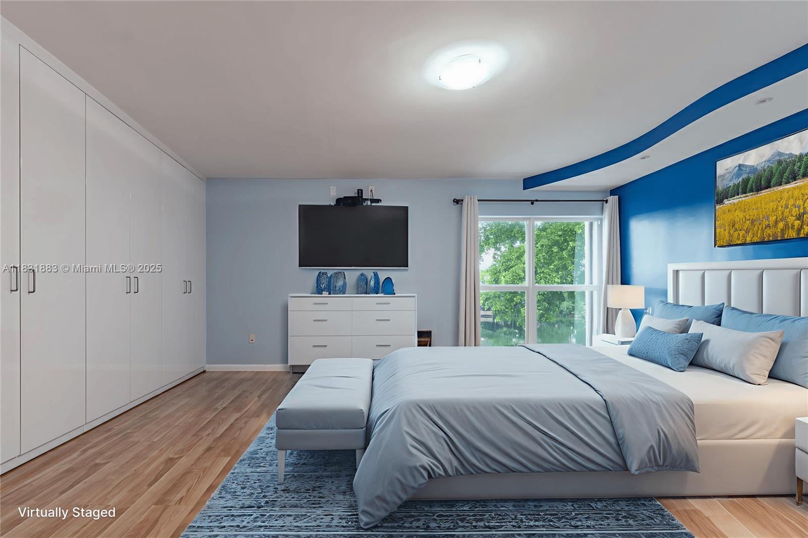 13949 Southwest 84th Street, Unit 801 Miami, FL 33143 - Photo 4 of 38 a bedroom with a bed and a flat screen tv