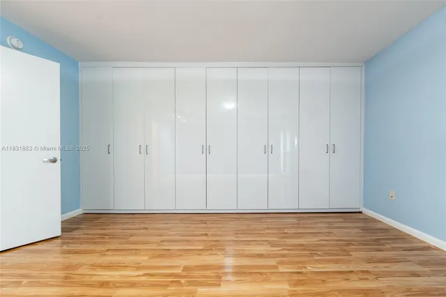 a view of room with wooden floor