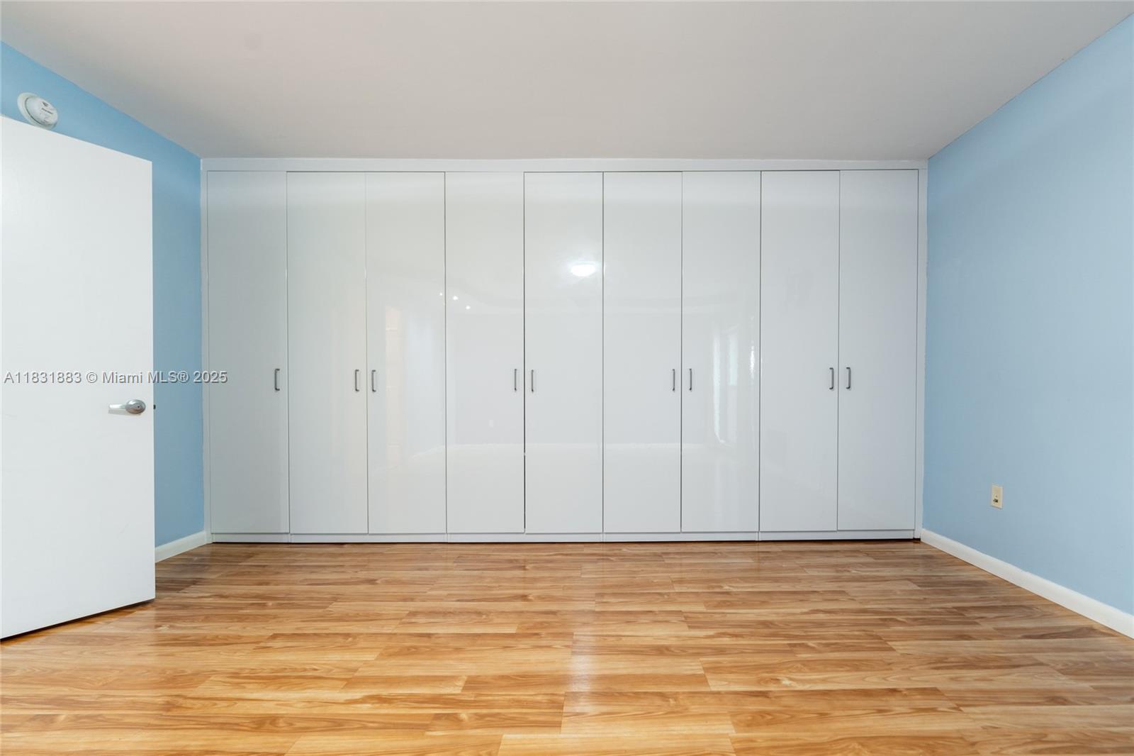 13949 Southwest 84th Street, Unit 801 Miami, FL 33143 - Photo 8 of 38 a view of room with wooden floor