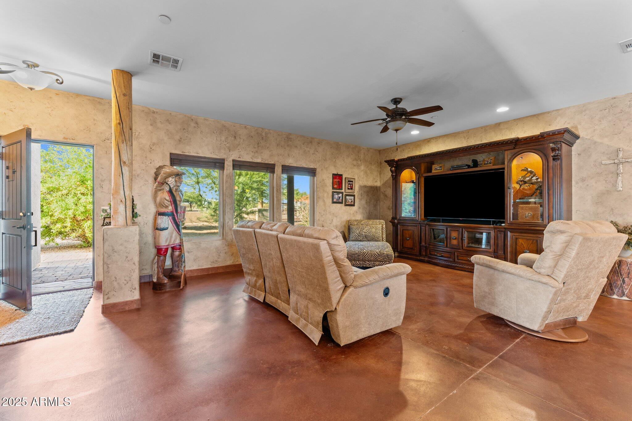 17789 West Peak View Road Surprise, AZ 85387 - Photo 15 of 69 a living room with furniture and a flat screen tv