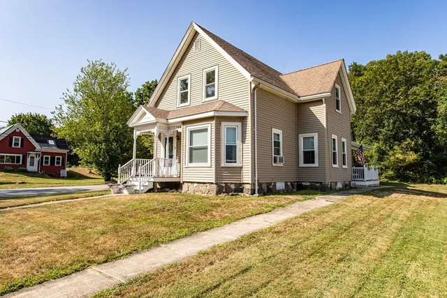 a front view of a house with a yard