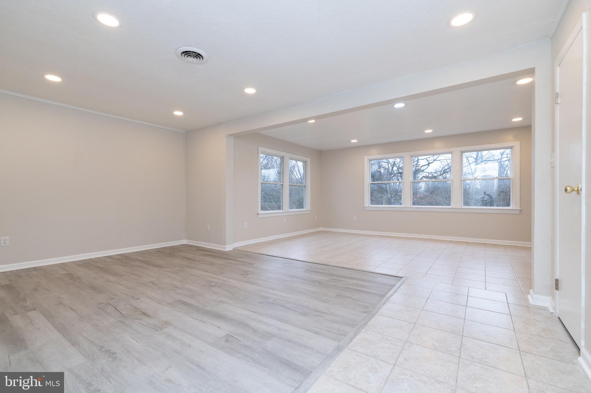 6731 Middle Road Middletown, VA 22645 - Photo 12 of 61 an empty room with wooden floor and windows