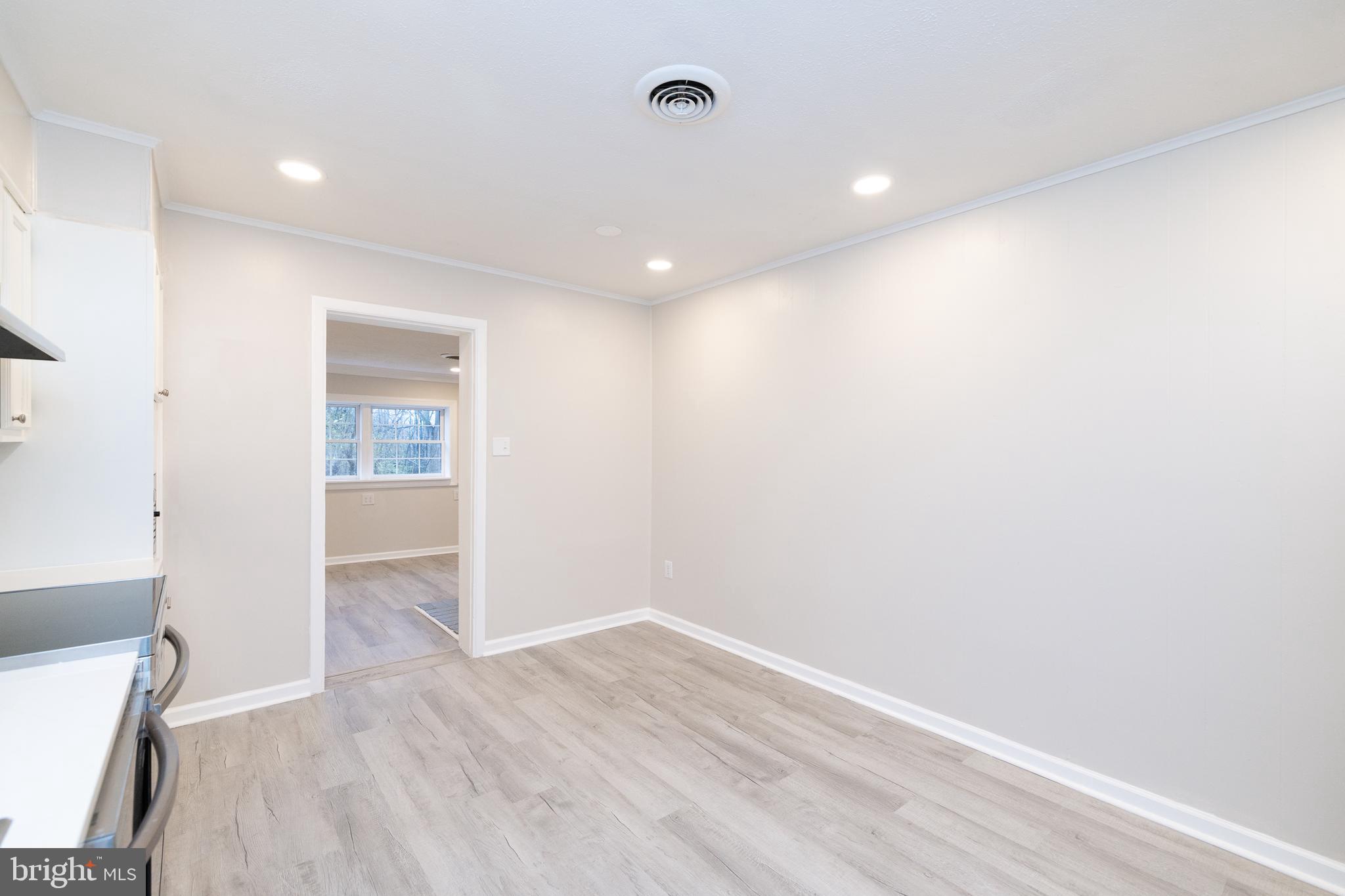 6731 Middle Road Middletown, VA 22645 - Photo 18 of 61 a view of an empty room with wooden floor