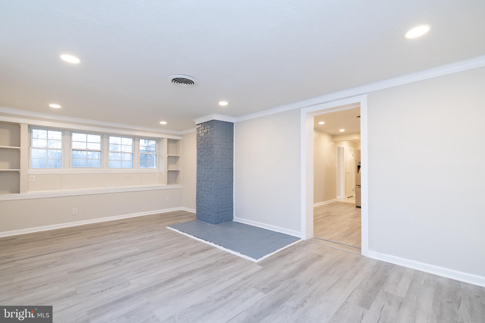 6731 Middle Road Middletown, VA 22645 - Photo 19 of 61 a view of an empty room with wooden floor and a window