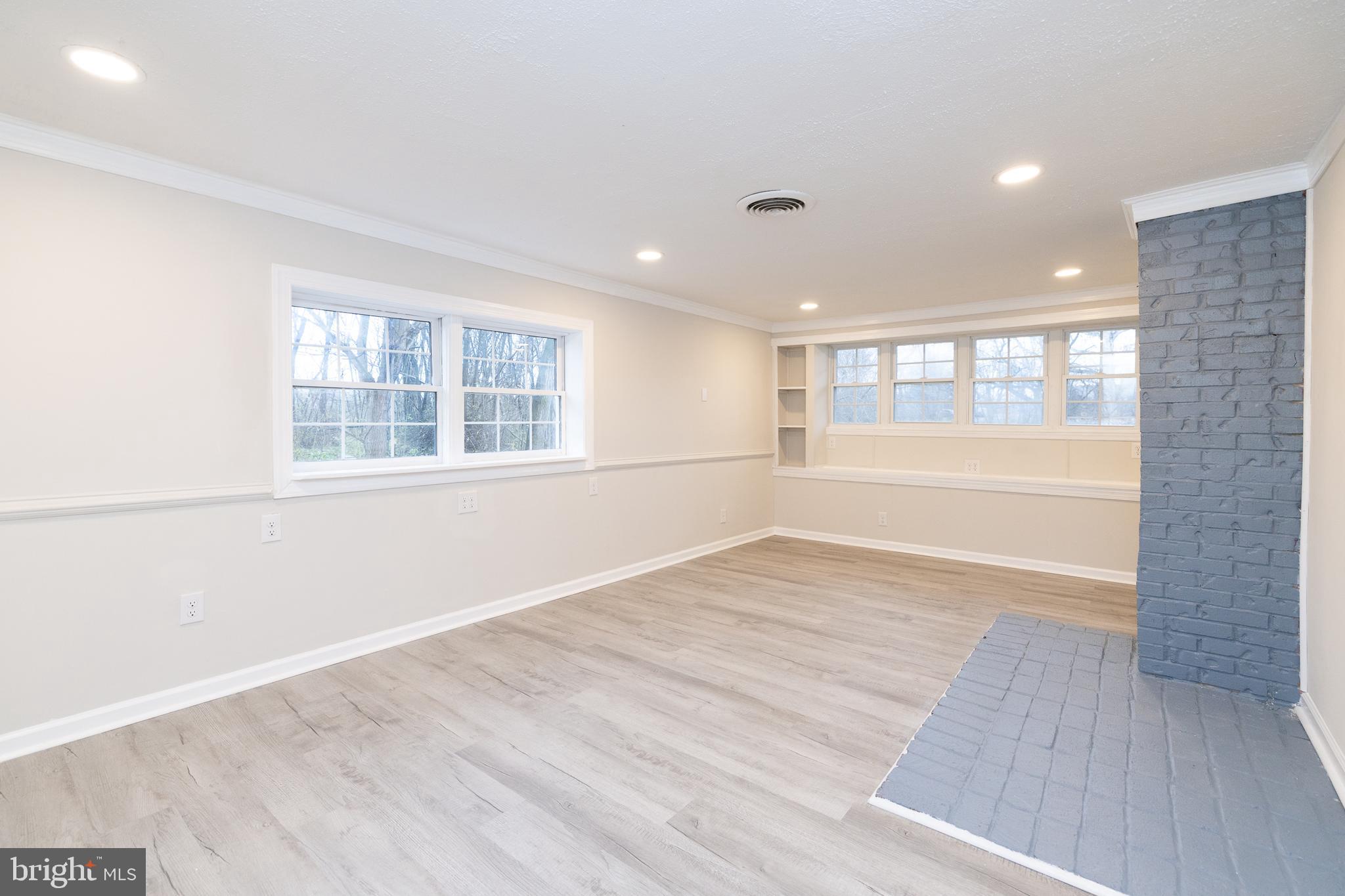6731 Middle Road Middletown, VA 22645 - Photo 21 of 61 an empty room with wooden floor and windows
