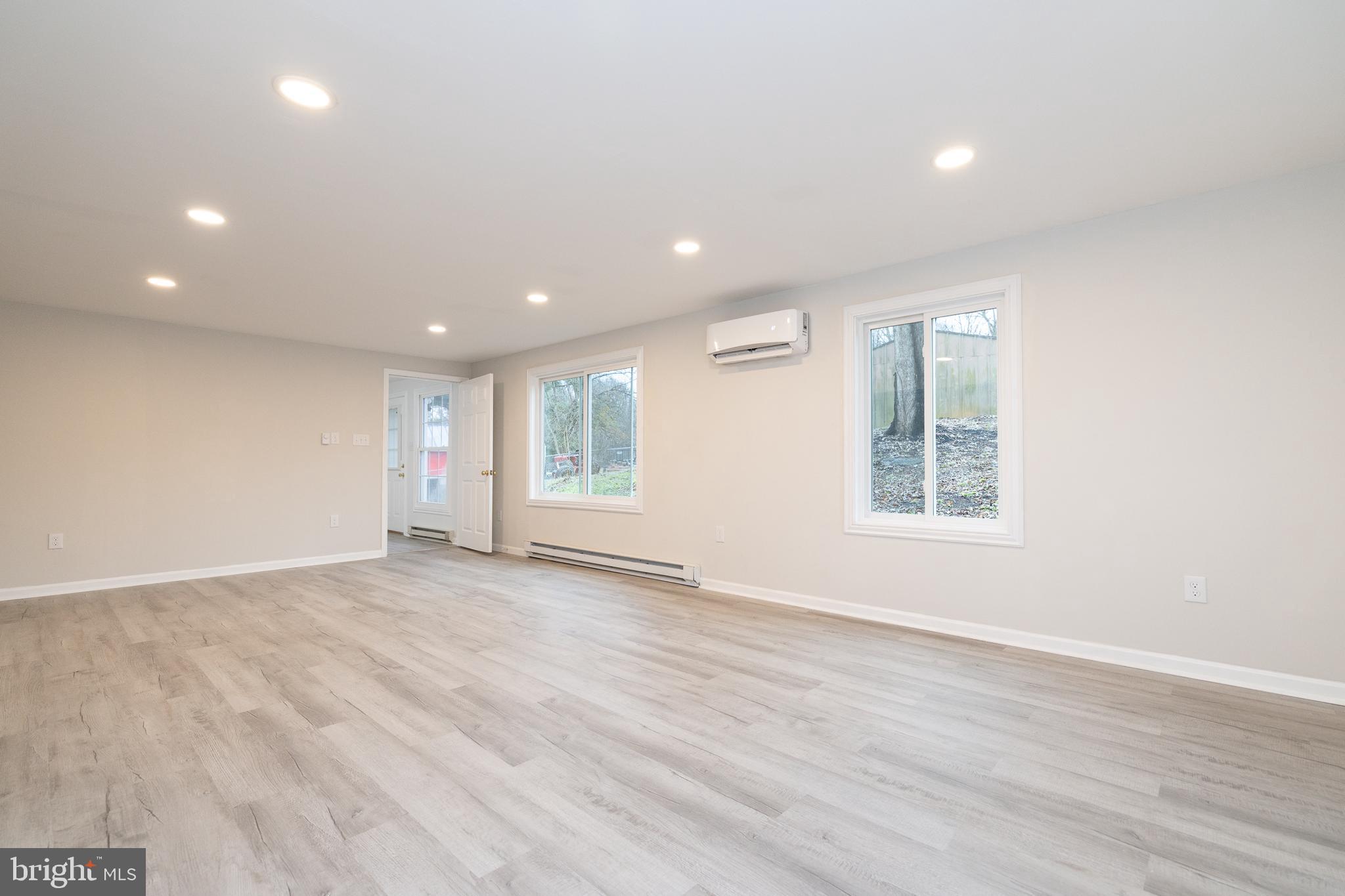 6731 Middle Road Middletown, VA 22645 - Photo 24 of 61 an empty room with wooden floor and windows