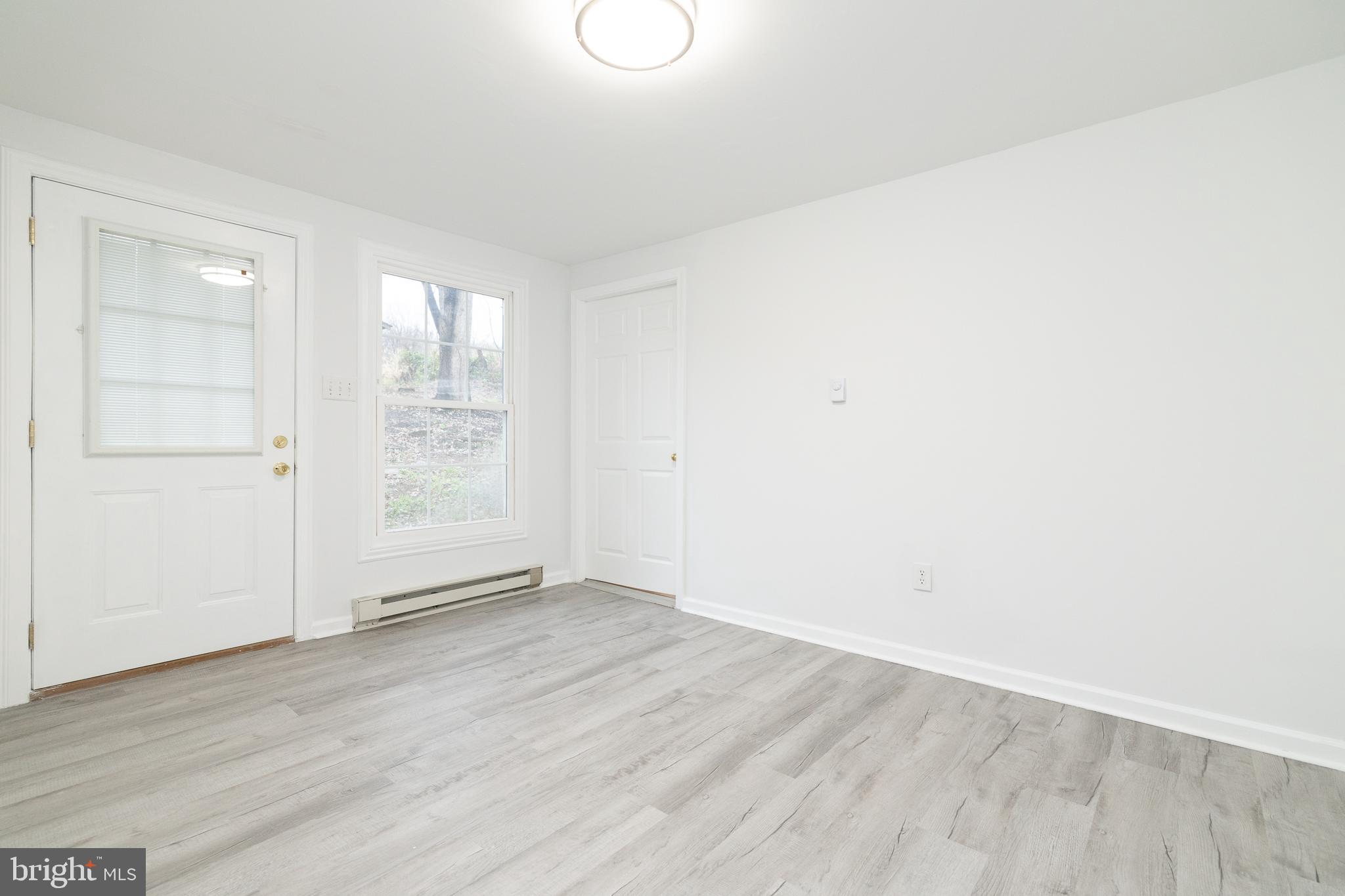 6731 Middle Road Middletown, VA 22645 - Photo 25 of 61 an empty room with wooden floor and windows