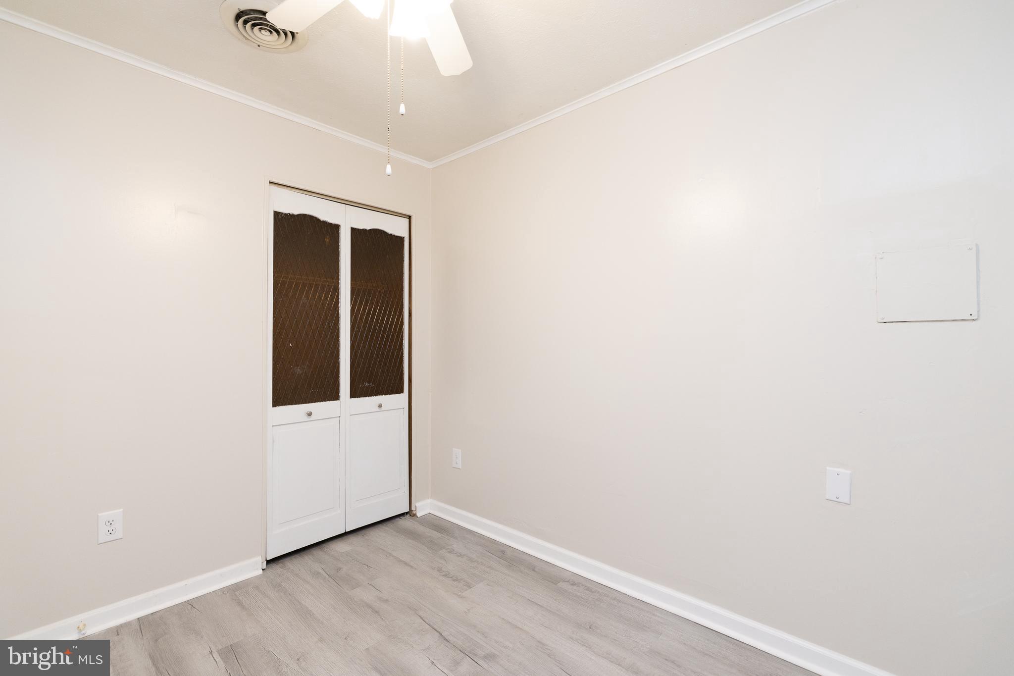 6731 Middle Road Middletown, VA 22645 - Photo 30 of 61 an empty room with wooden floor and windows
