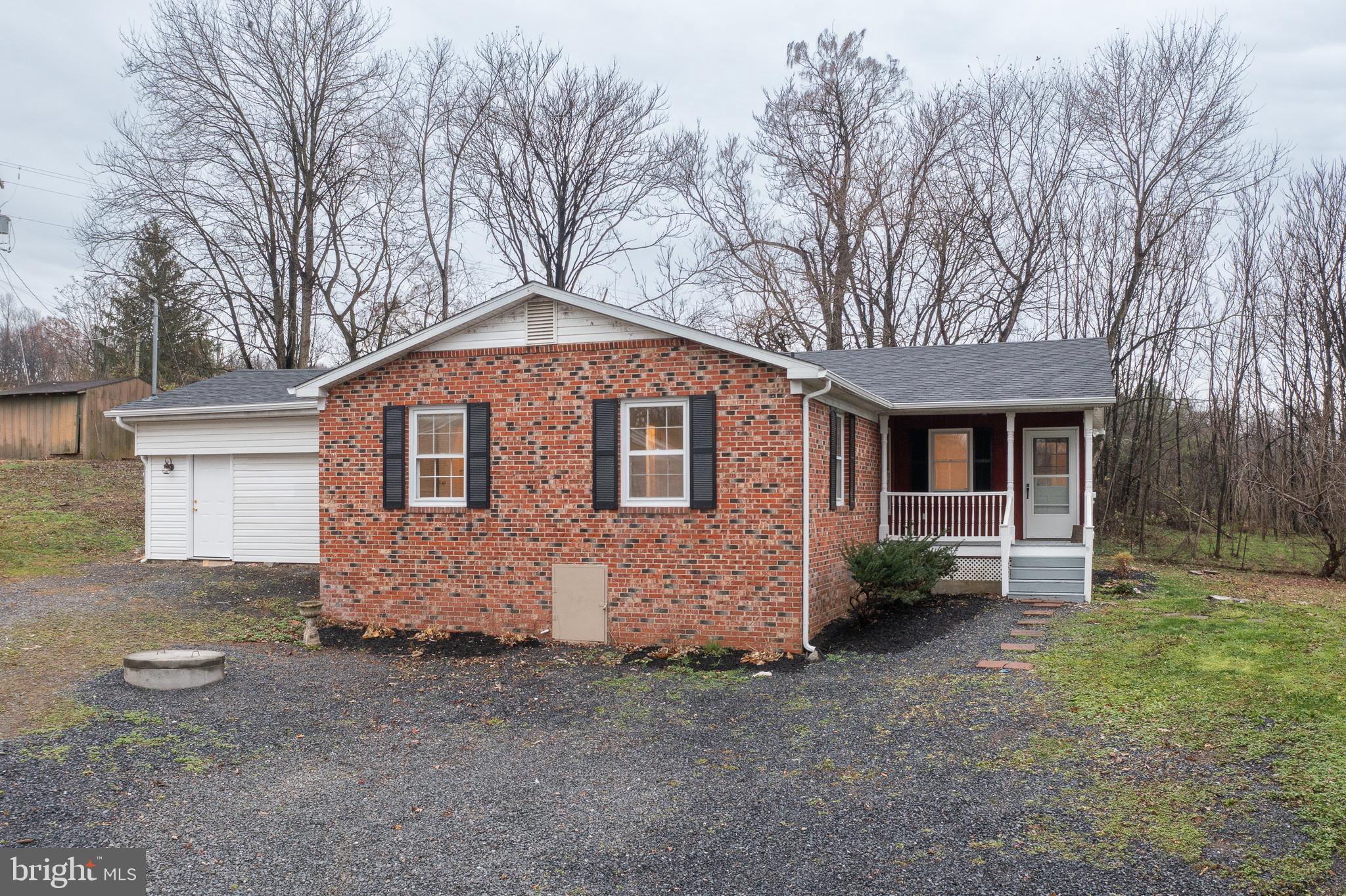 6731 Middle Road Middletown, VA 22645 - Photo 3 of 61 a front view of a house with a yard and garage