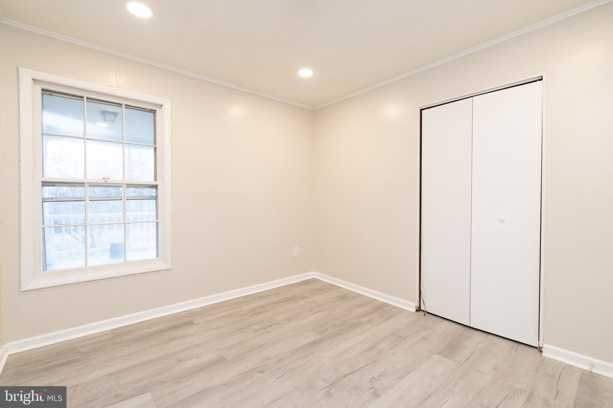6731 Middle Road Middletown, VA 22645 - Photo 32 of 61 an empty room with wooden floor and windows