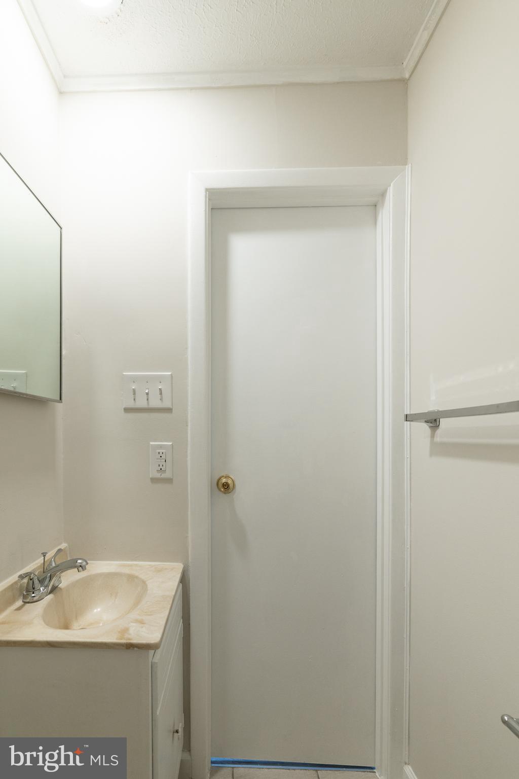 6731 Middle Road Middletown, VA 22645 - Photo 41 of 61 a bathroom with a granite countertop sink and a mirror