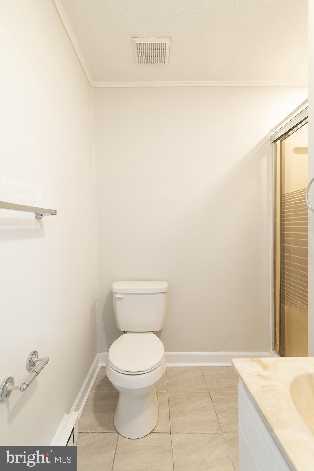 6731 Middle Road Middletown, VA 22645 - Photo 42 of 61 a white toilet sitting next to a bathroom sink