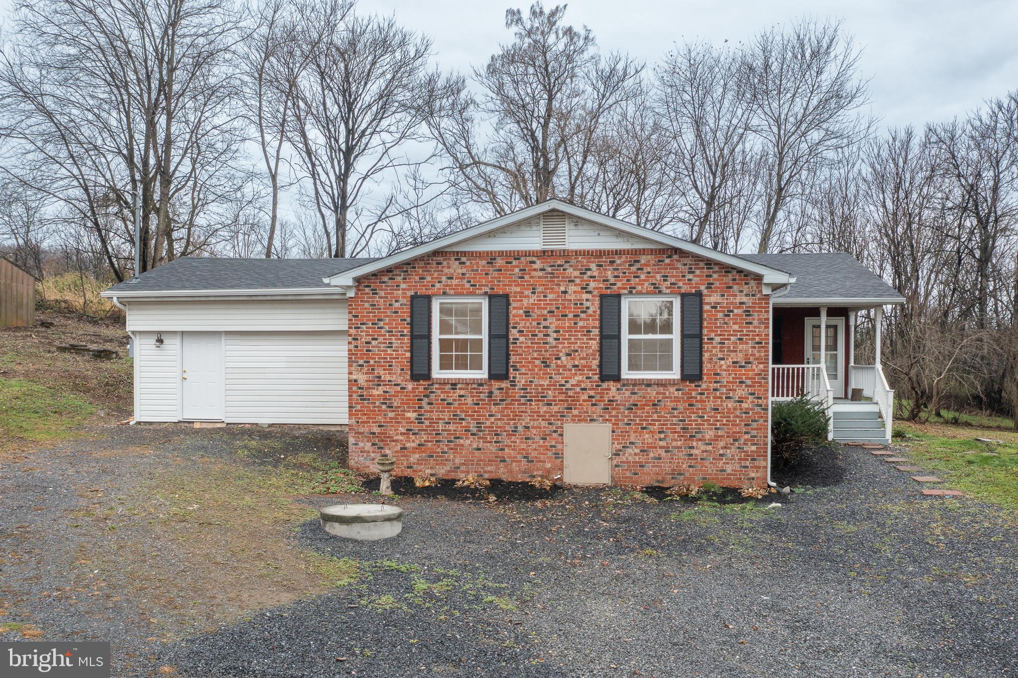 6731 Middle Road Middletown, VA 22645 - Photo 60 of 61 a front view of a house with a yard and garage