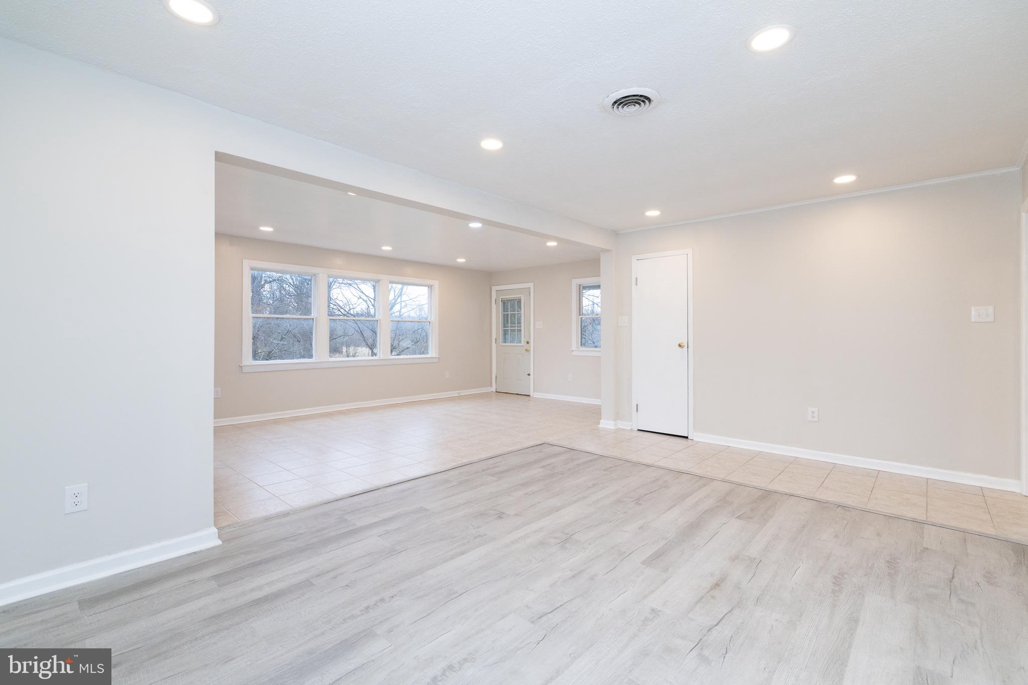 6731 Middle Road Middletown, VA 22645 - Photo 10 of 61 an empty room with wooden floor and windows