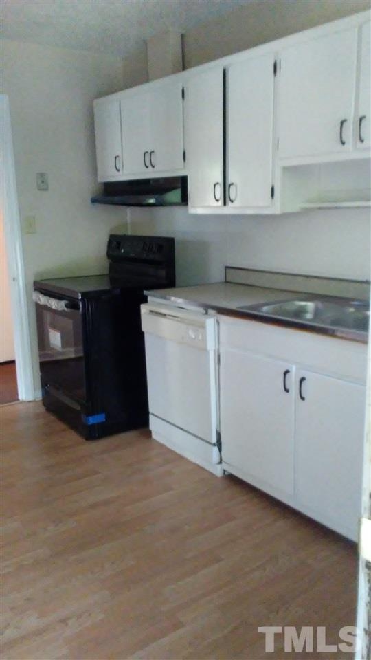 905 Culpepper Lane Raleigh, NC 27610 - Photo 3 of 7 a kitchen with cabinets and a stove