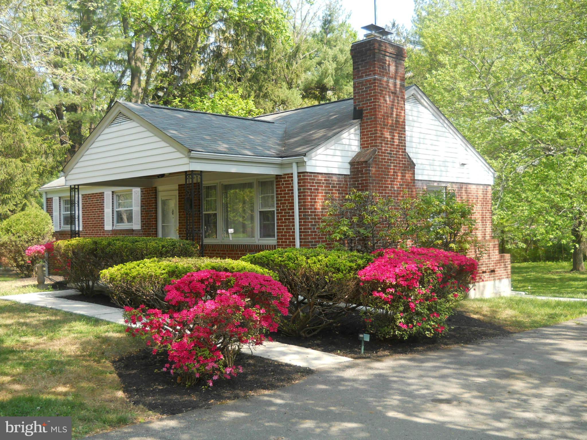 4113 Raleigh Road Baltimore, MD 21207 - Photo 1 of 23 a front view of a house with a yard and garage