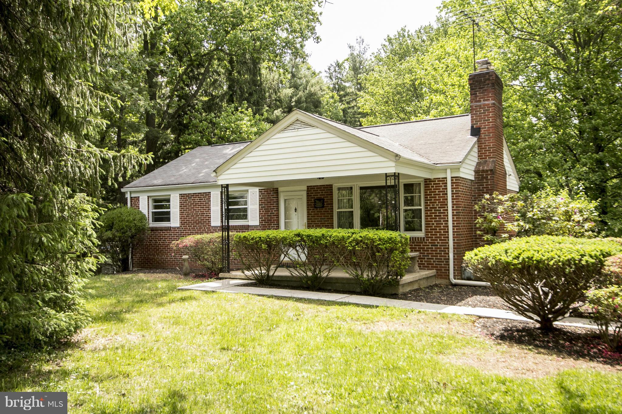 4113 Raleigh Road Baltimore, MD 21207 - Photo 2 of 23 a front view of a house with a yard