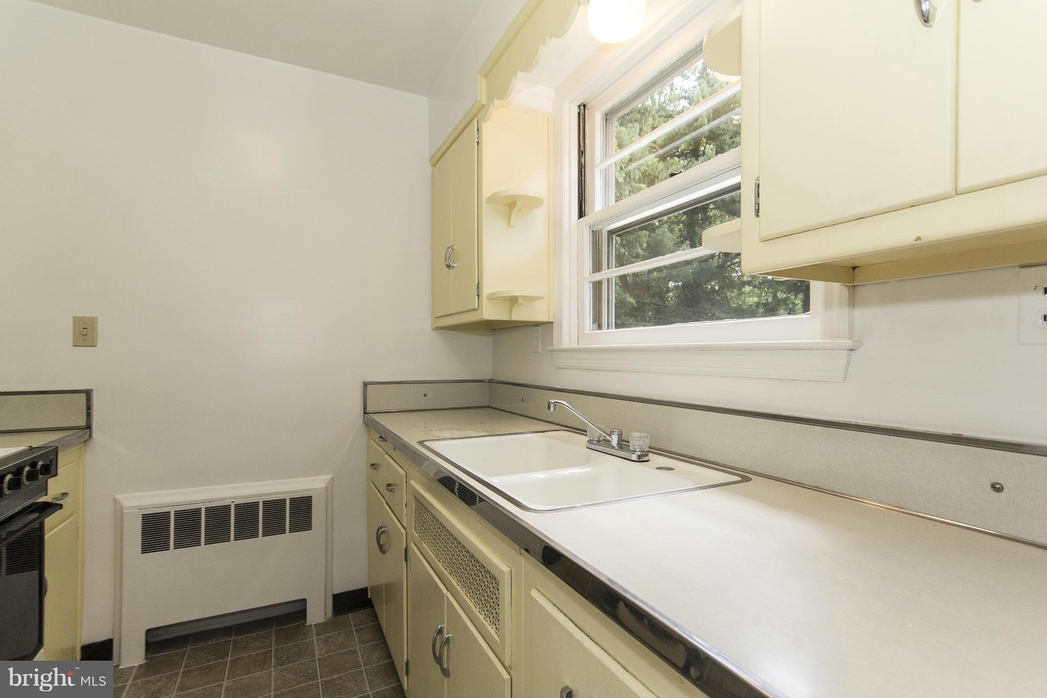 4113 Raleigh Road Baltimore, MD 21207 - Photo 10 of 23 a bathroom with a sink and a mirror