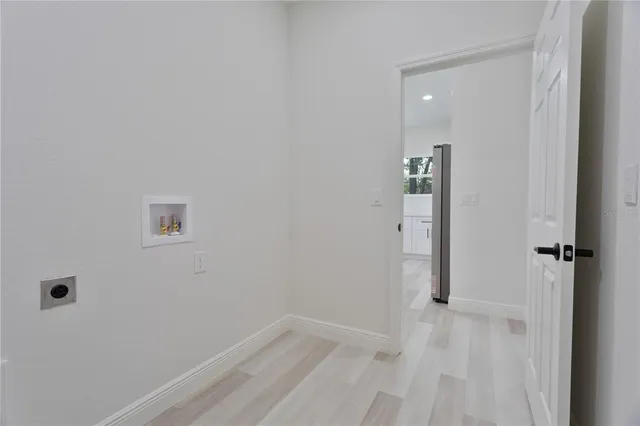 a view of a hallway with closet