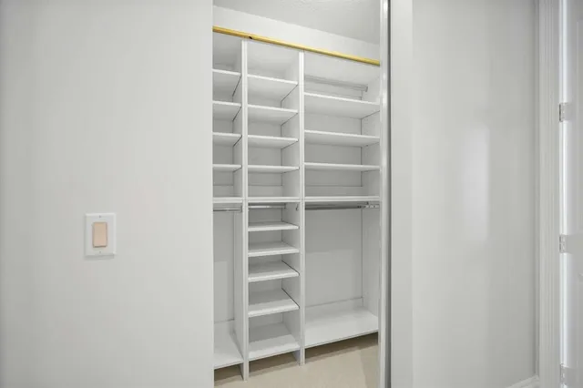 a bathroom with a sink a mirror and a shower