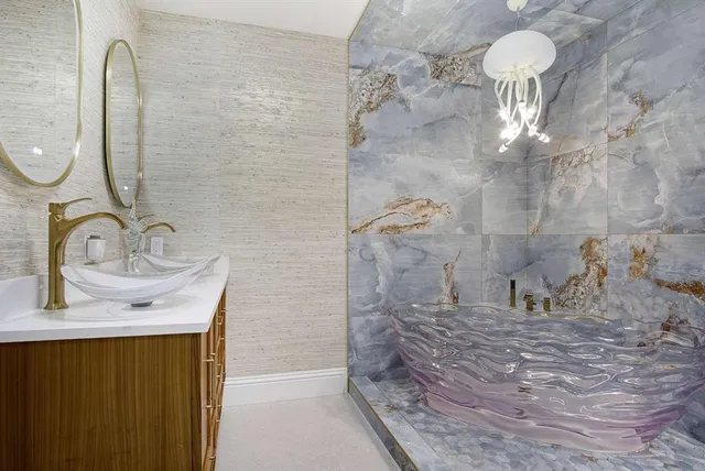 a bathroom with a sink and a mirror