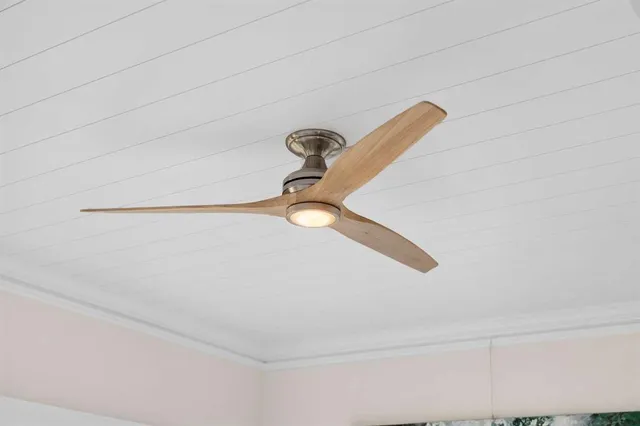 an aerial view of a house with a lake view