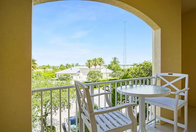 a view white cabinets and a wooden floor