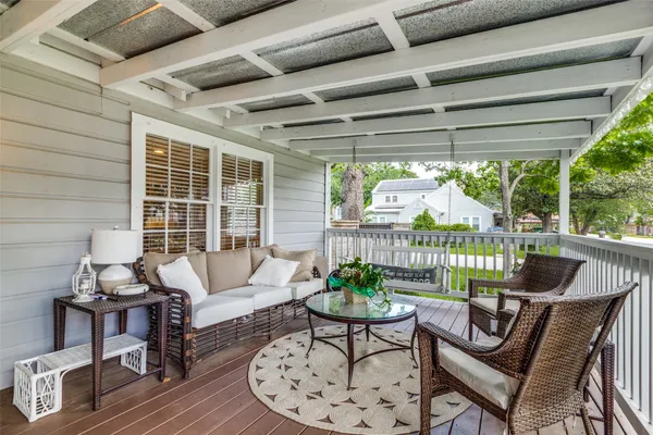 a living room with furniture and windows