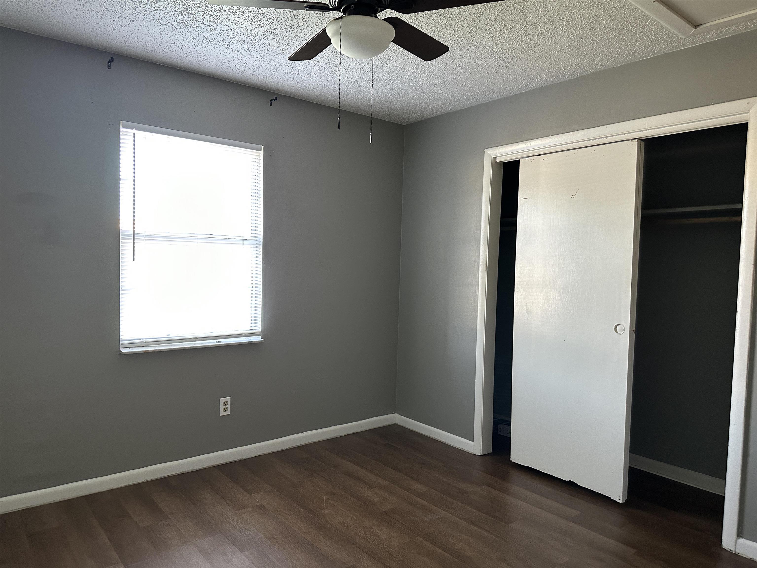 3661 A1A South St. Augustine, FL 32080 - Photo 6 of 8 an empty room with wooden floor cabinet and windows