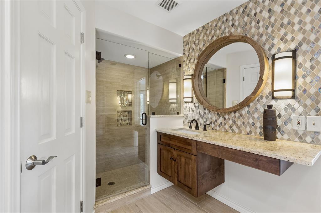 4 Eastshore Road Heath, TX 75032 - Photo 30 of 37 a bathroom with a sink double vanity and a mirror