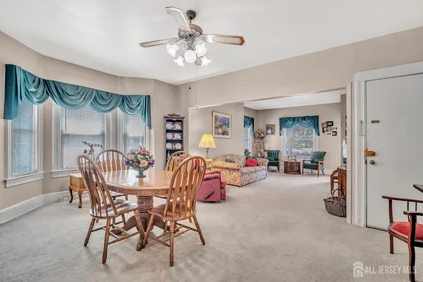 a view of a livingroom with furniture and a window