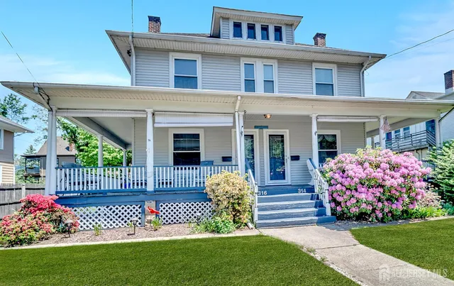 a front view of a house with a garden and garden