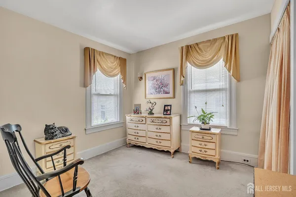 a bed room with a bed and a window