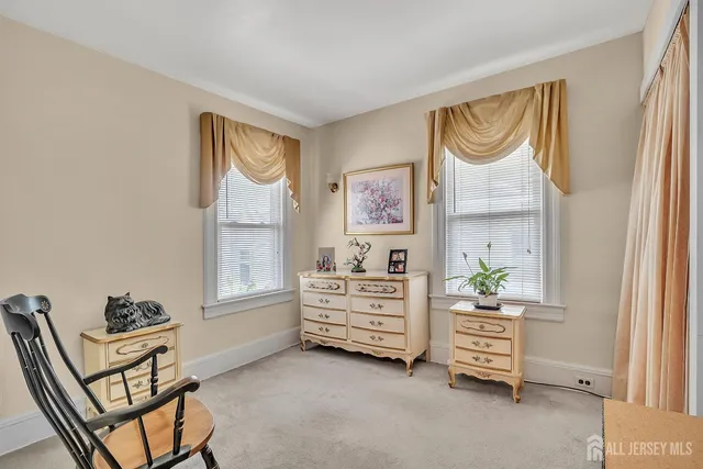 a bed room with a bed and a window