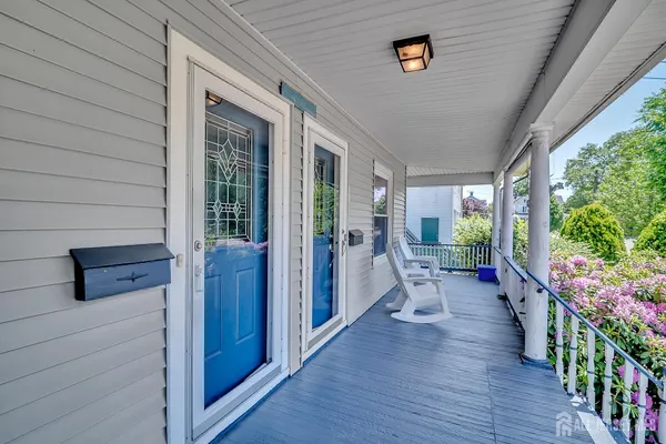 a porch with wooden floor