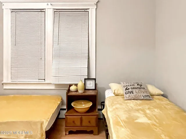 a bathroom with a bathtub and next to a window
