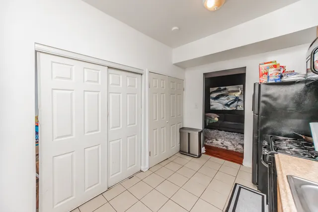 a kitchen with a sink a stove and cabinets