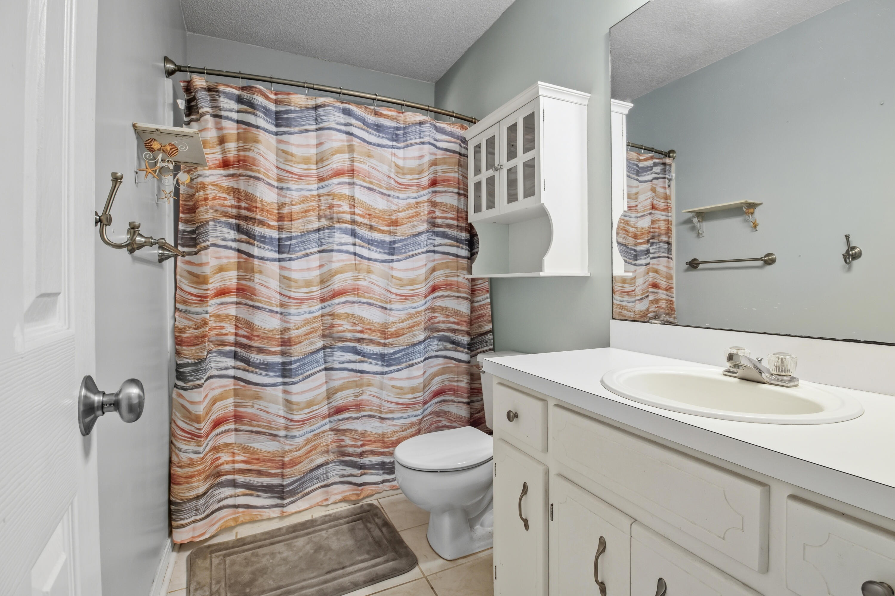 3014 Windsor Circle Crestview, FL 32539 - Photo 11 of 26 a bathroom with a sink toilet and shower