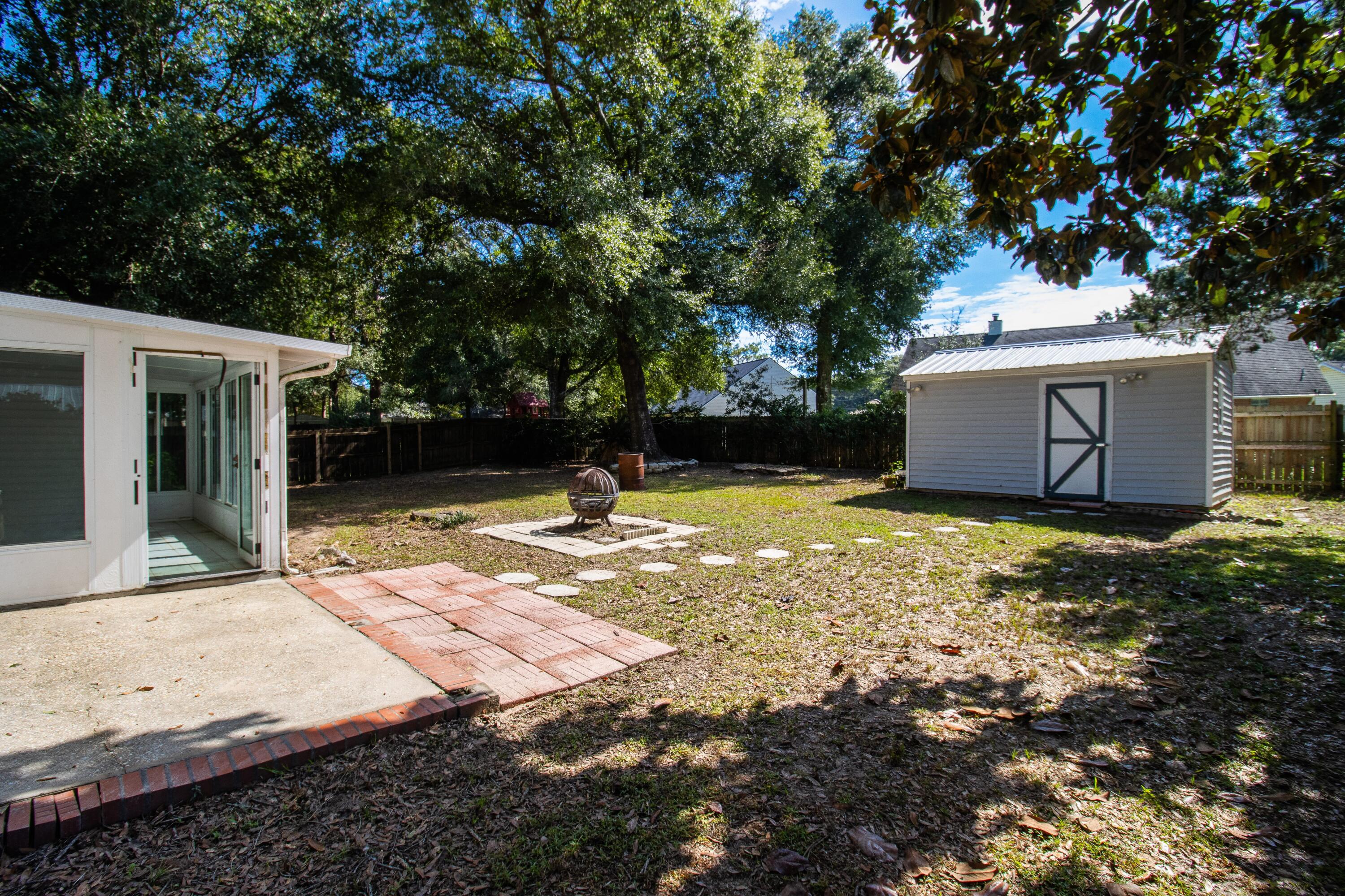 3014 Windsor Circle Crestview, FL 32539 - Photo 17 of 26 a view of a house with backyard and tree