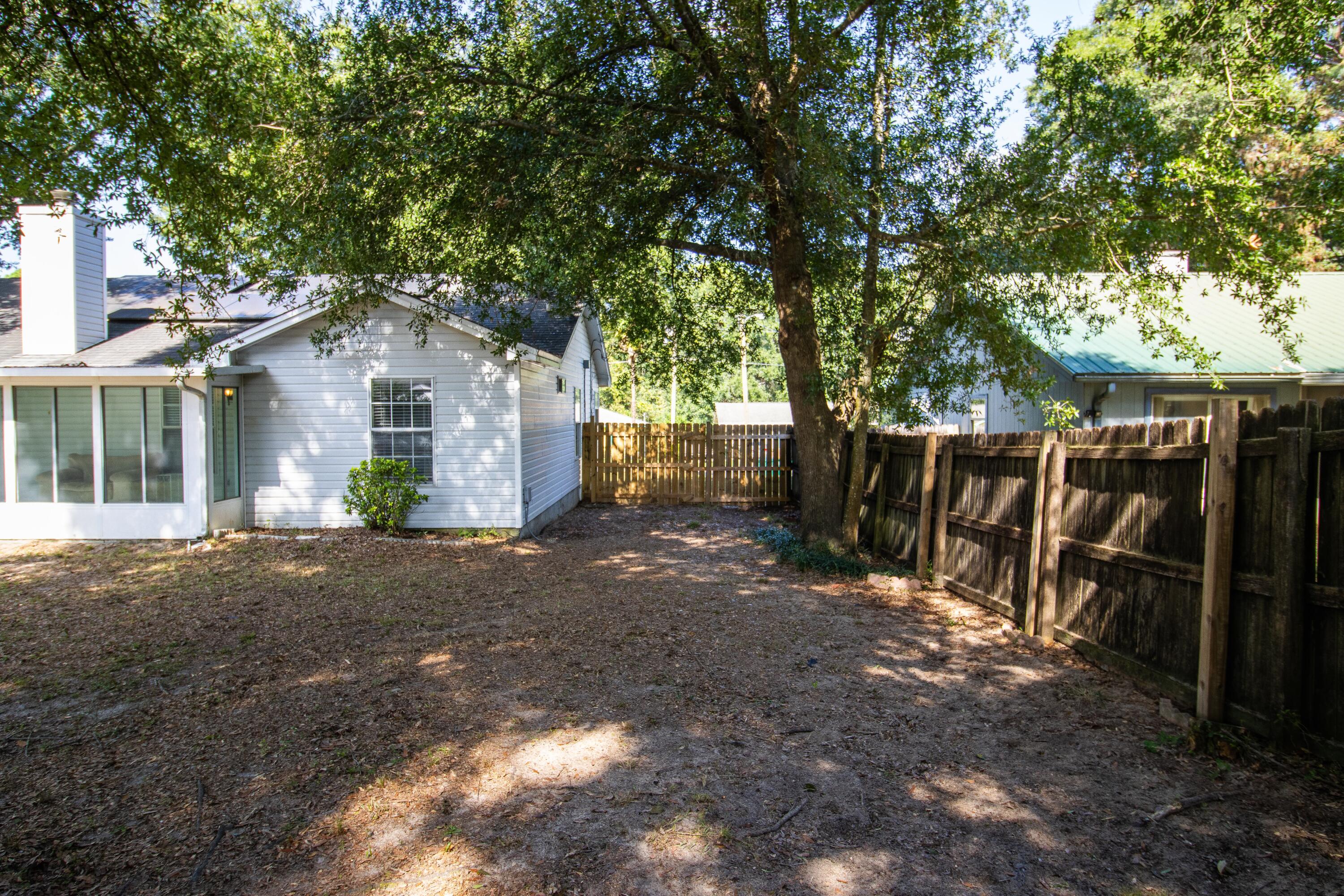 3014 Windsor Circle Crestview, FL 32539 - Photo 21 of 26 a view of a house with backyard and tree