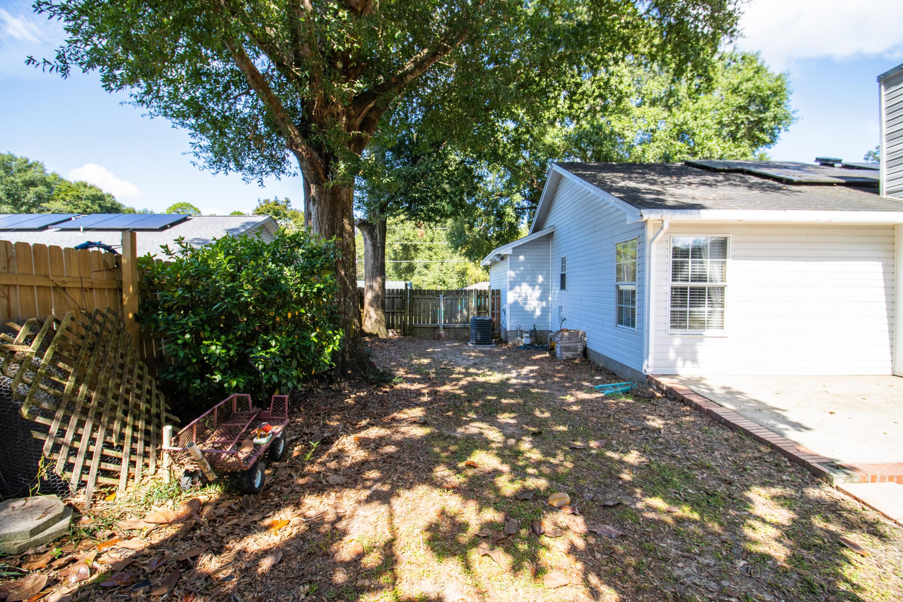 3014 Windsor Circle Crestview, FL 32539 - Photo 22 of 26 a view of a house with a yard