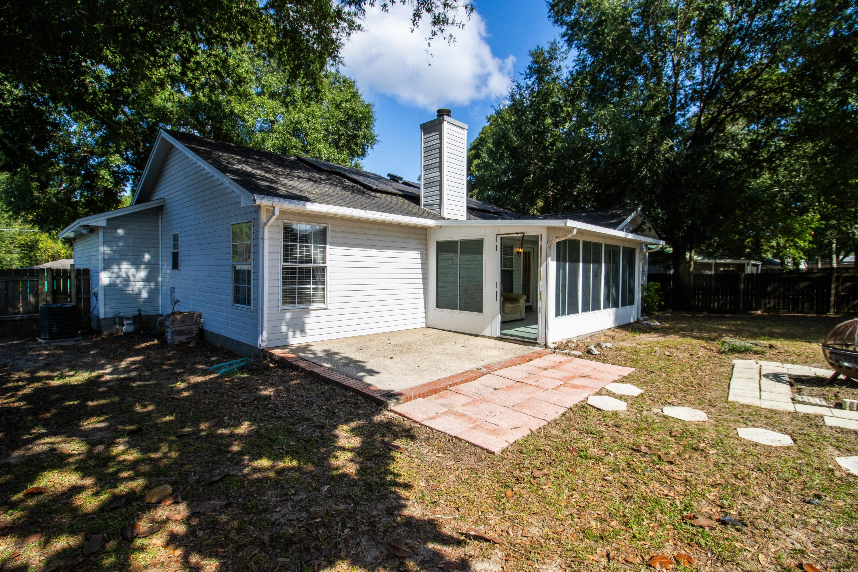 3014 Windsor Circle Crestview, FL 32539 - Photo 23 of 26 a view of a house with backyard and sitting area