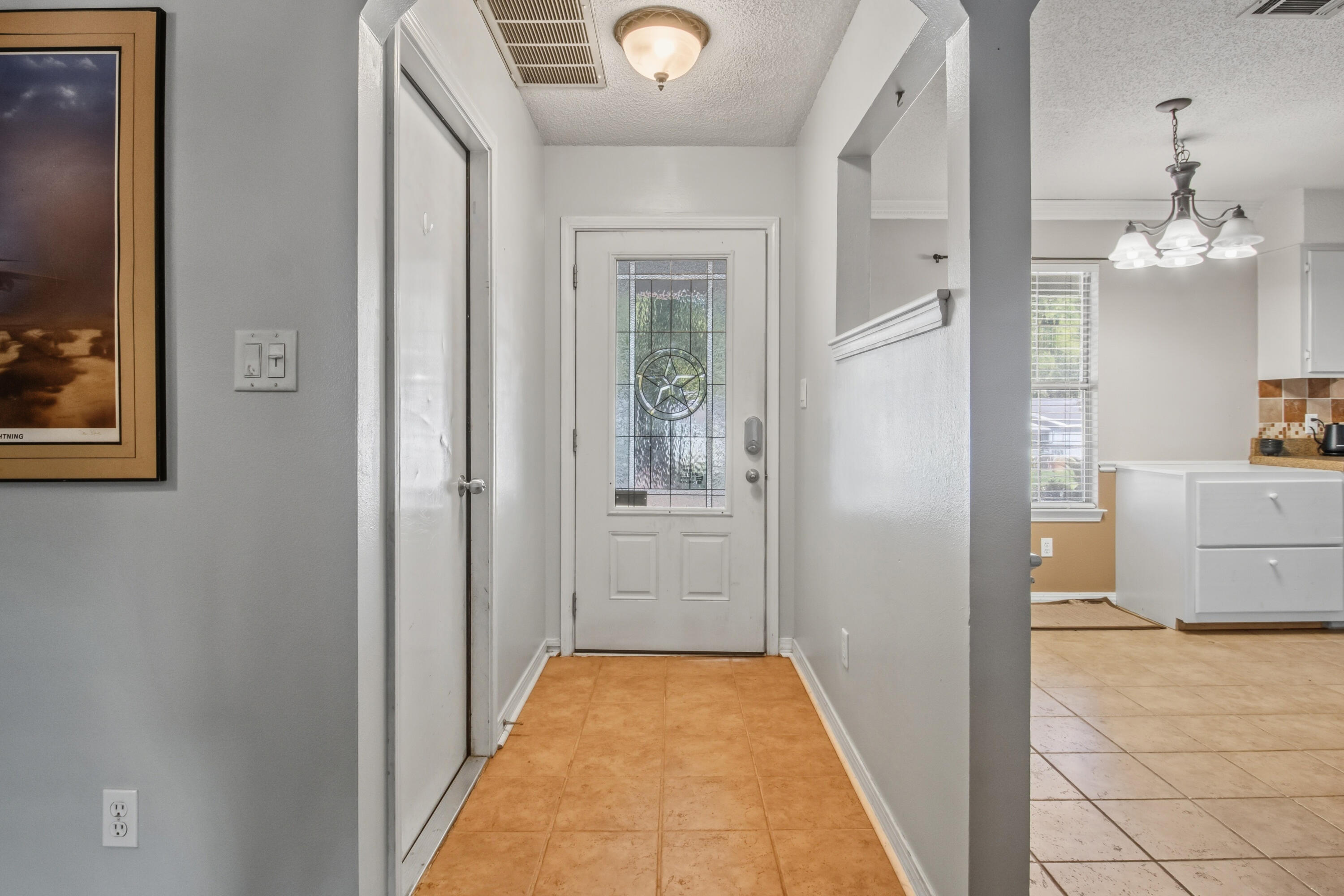 3014 Windsor Circle Crestview, FL 32539 - Photo 4 of 26 a view of a hallway view with wooden floor and a living room