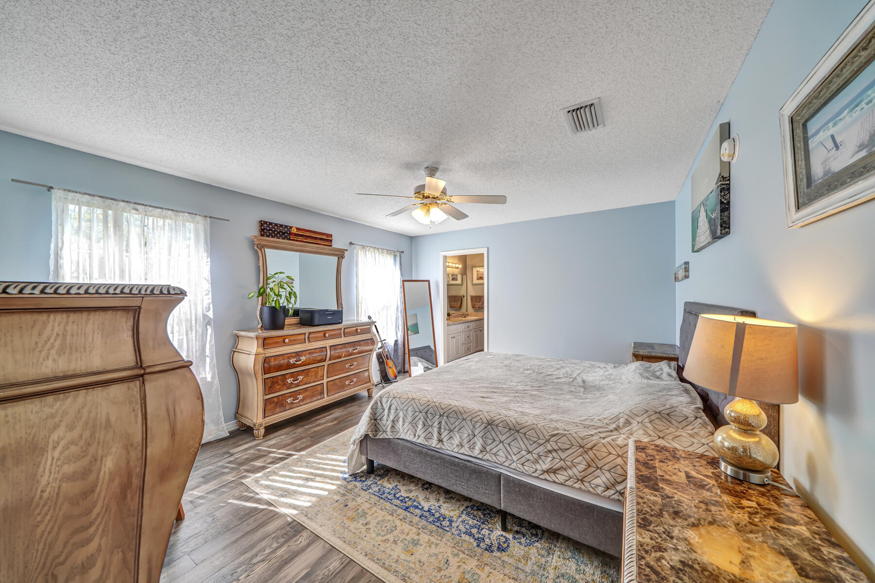 1787 Old Ranch Road Fort Walton Beach, FL 32547 - Photo 11 of 25 a bedroom with a bed a dresser and next to a window