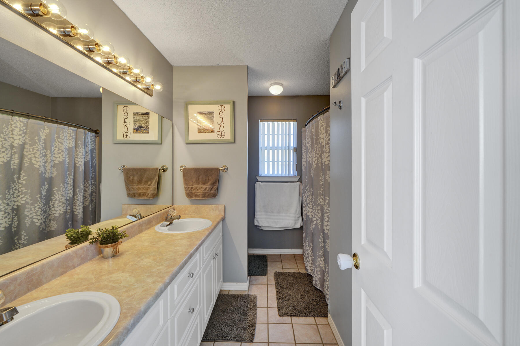 1787 Old Ranch Road Fort Walton Beach, FL 32547 - Photo 13 of 25 a bathroom with a granite countertop double vanity sink a mirror and a shower