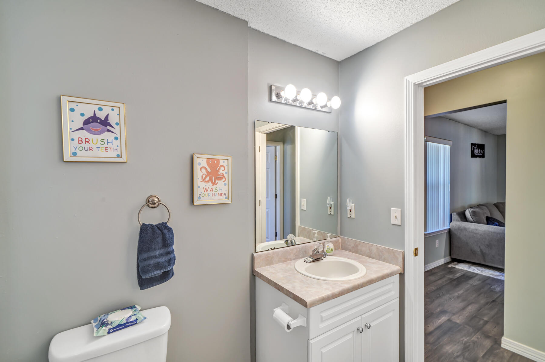 1787 Old Ranch Road Fort Walton Beach, FL 32547 - Photo 20 of 25 a en suite bathroom with a sink and a mirror